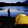 Camper with mug on Sparks Lake shore